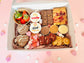 Valentine’s sharing hamper open box showing brownie hearts, cupcakes, cookies, sweets and dipping sauces